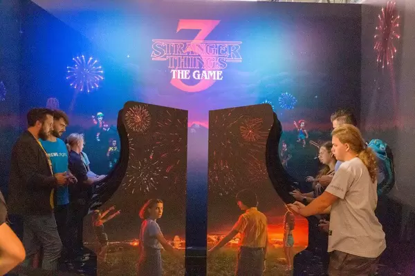 Gamesfair visitors play the action-adventure video game of the Netflix Show Stranger Things