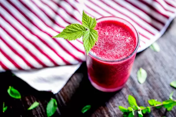 Garnished glass of blackberry smoothie