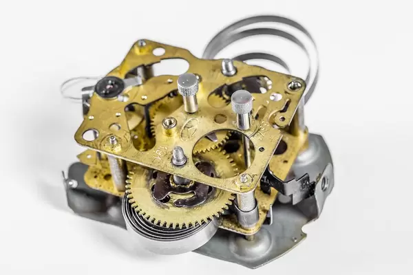 Gears and cogs in old vintage retro mechanism macro closeup