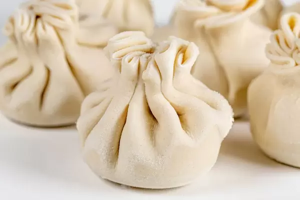 Georgian homemade khinkali on white background