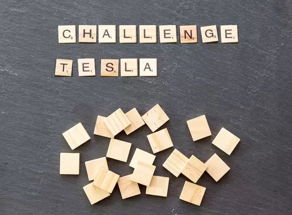 German Carmakers Urged to Challenge Tesla by Senior Merkel Aide