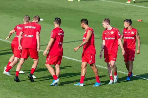 German soccer player during athletic running training outside on the soccer field