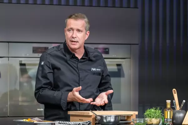 German star chef Alexander Herrmann in front of live audience at IFA Miele stand - international exhibition for consumer electronics und home appliances
