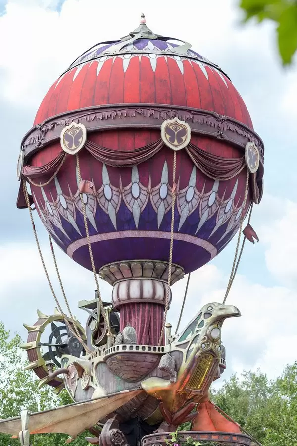 Giant gold-purple inflatable airship forming a bird at Tomorrowland festival, Belgium