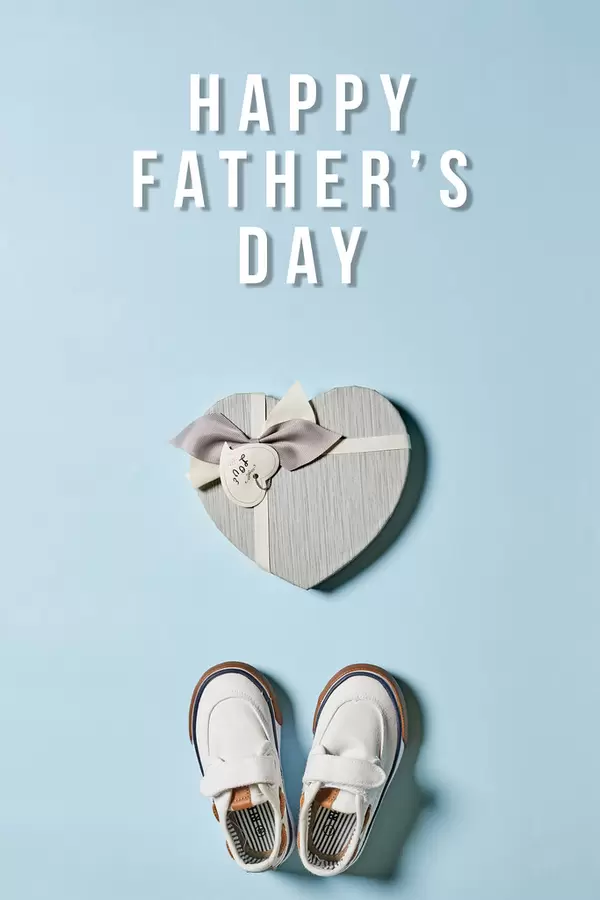 Gift box, baby's shoes and greeting text - Happy father's day