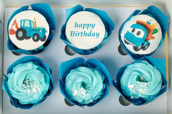 Gift box with cupcakes for a boy, top view