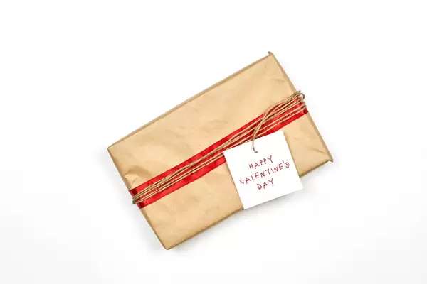 Giftbox wrapped in eco paper on white background