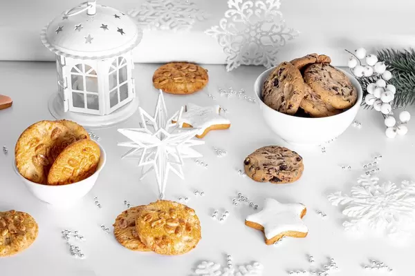 Ginger, chocolate and peanut cookies on a light Christmas background (Flip 2019)