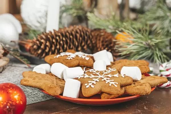 Ginger cookies and marshmallows on the christmas table with decor