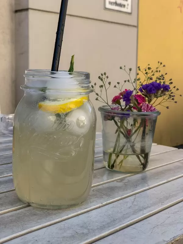 Ginger-lemon lemonade and flowers in a glass