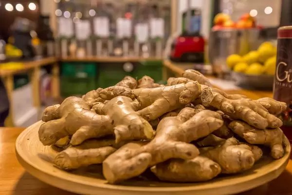 Ginger on counter on wooden plate