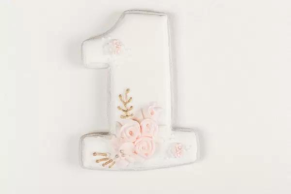 Gingerbread number one on a white background. Birthday cookies