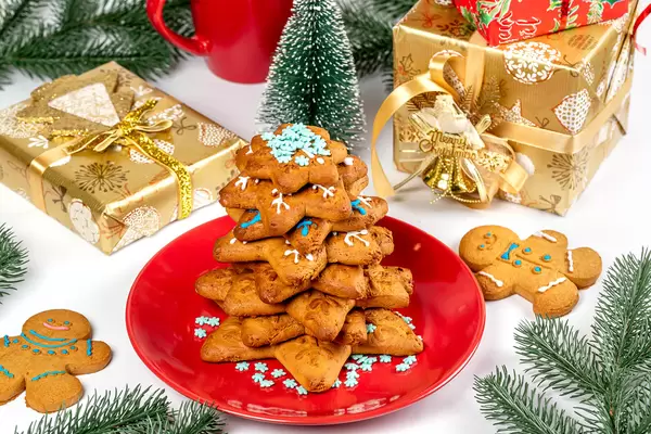 Gingerbread with gifts and christmas tree branches