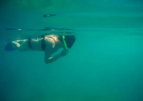 Girl diving underwater