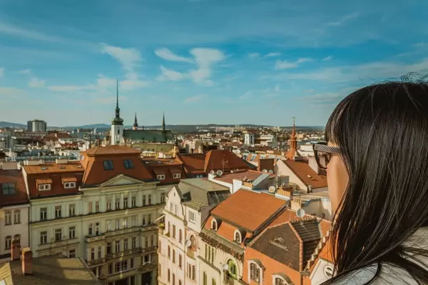 Girl enjoying view from Old Town Hall clock tower in Brno