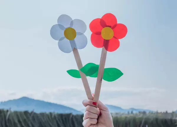 Girl holding paper flowers
