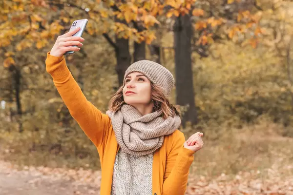 Girl takes a selfie on her mobile phone