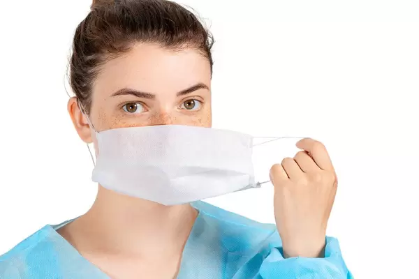 Girl with a protective medical mask. Disease prevention, health Care