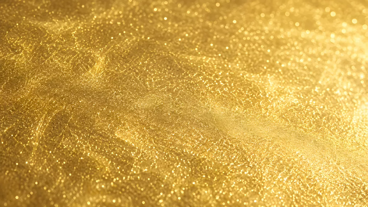Glänzende Goldfolie mit funkelnden Lichtreflexen