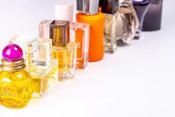 Glass bottles with different perfumes on a white background (Flip 2020)