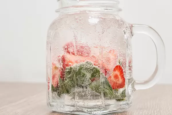 Glass of strawberry soda drink