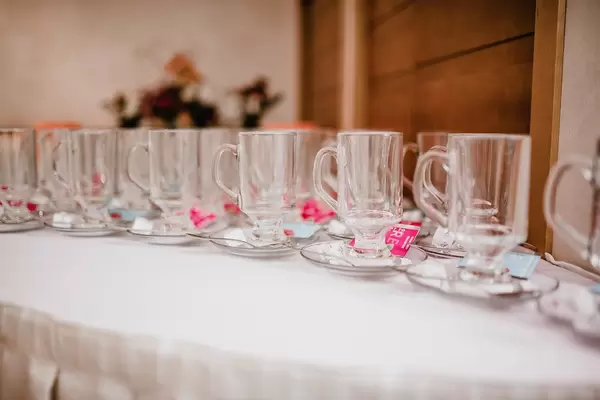 Glass Tea Cups Served On The White Table