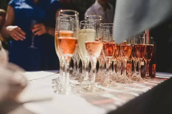 Glasses Of A Champagne In A Row On The Table