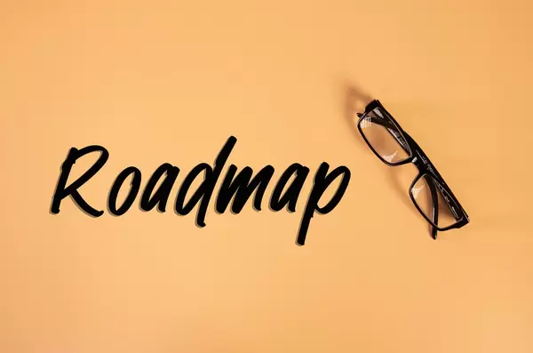Glasses with Roadmap text on orange background