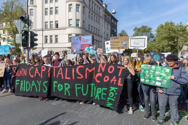 Global climate strike: Children protesting and marching to demand the end of fossil fuel projects