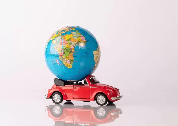 Globe on a red beetle car (Flip 2019)