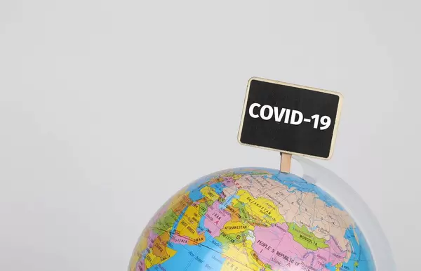 Globe with COVID-19 sign