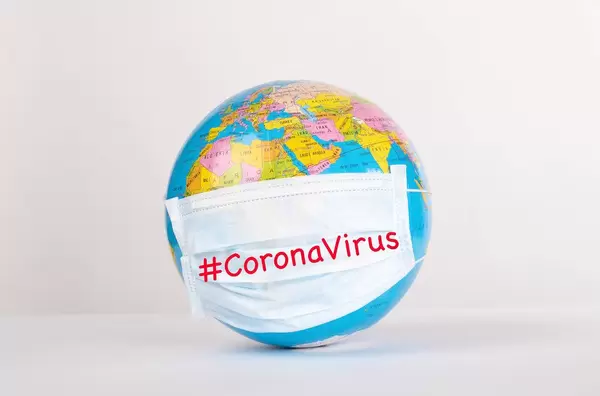Globe with medical mask on white background with #CoronaVirus text.jpg