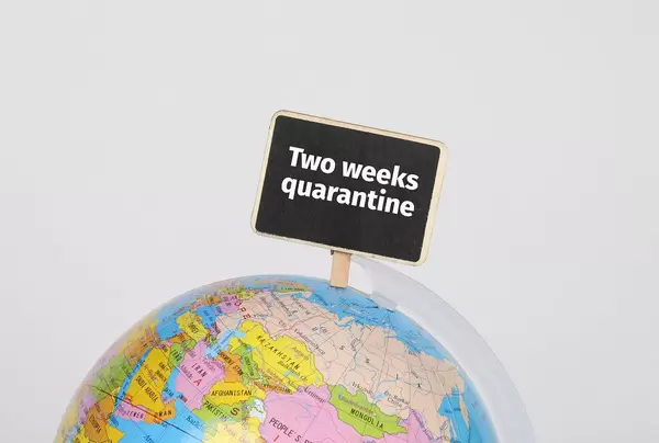 Globe with Two weeks quarantine sign