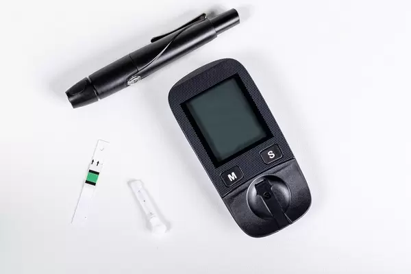 Glucometer set on a white background. Rapid blood glucose test device