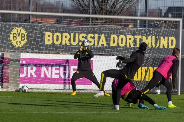 Goalkeeper Marwin Hitz catches the ball during the Borussia Dortmund public training