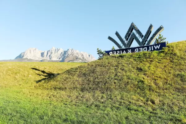 Going am Wilden Kaiser logo with Wilder Kaiser on background, Austria (Flip 2019)