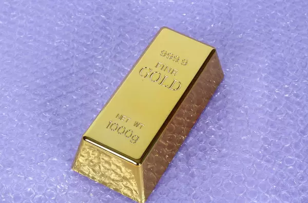 Gold bar on bubble wrap