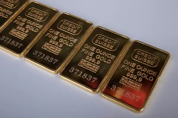 Gold bars on grey background