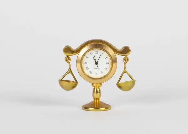 Gold libra with watch