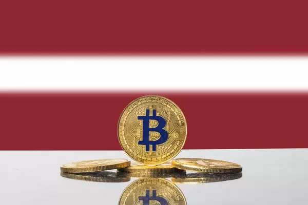 Golden Bitcoin and flag of Latvia