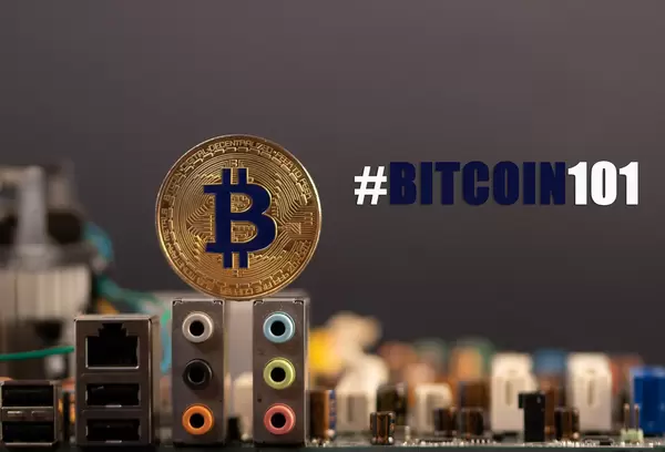 Golden Bitcoin with computer parts and #Bitcoin101 text