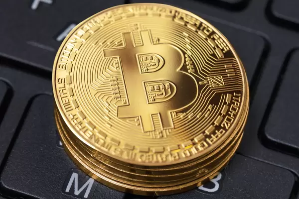 Golden bitcoins on the keyboard