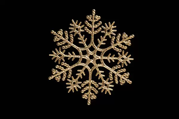 Golden Christmas snowflake on black background