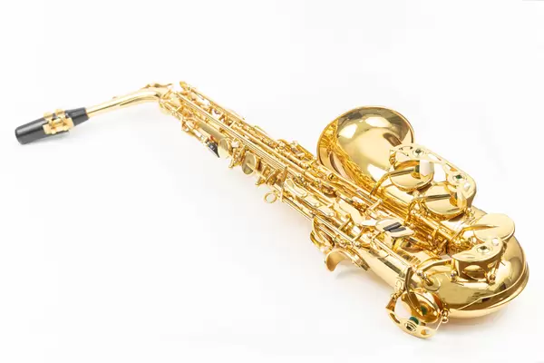 Golden color Saxophone isolated above white background