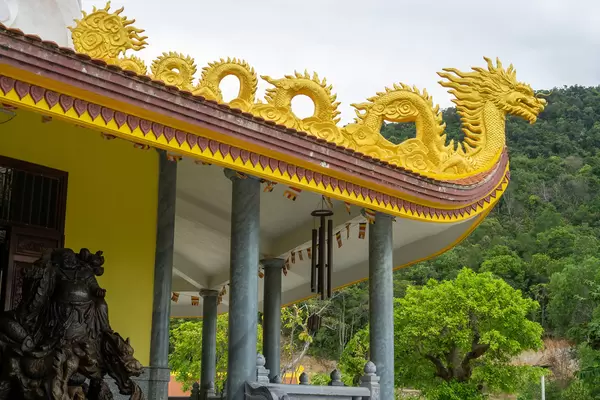 Golden Dragon Ornament on top of a Buddhist Temple Building at Ho Quoc Temple Complex on Phu Quoc Island, Vietnam