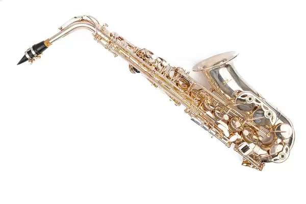 Golden Metal Saxophone above white background with copy space