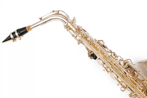 Golden Metal Saxophone with copy space above white