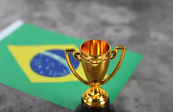 Golden trophy with flag of Brasil