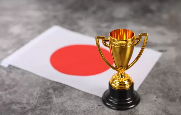 Golden trophy with flag of Japan