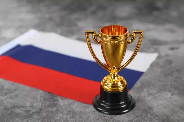 Golden trophy with flag of Russia